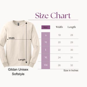 May include: Cream-colored Gildan Unisex Softstyle long-sleeve shirt with a size chart. The chart shows measurements in inches for sizes S to XXL, with widths from 18 to 26 inches and lengths from 28 to 32 inches.