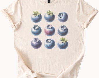 Camiseta con estampado de arándanos, ilustración artística y botánica de nueve bayas, inspirada en la naturaleza, ideal para el verano.