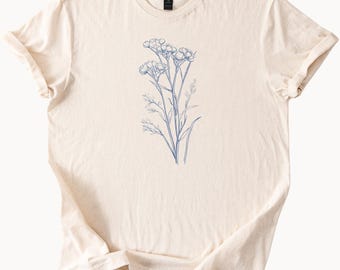 Camiseta con estampado de flores silvestres y diseño botánico. Camiseta con dibujo floral inspirado en la naturaleza.