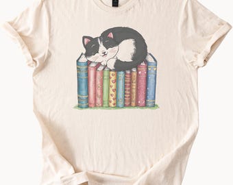 Cute Cat Sleeping on Colorful Books Graphic Tee Cat Lover Shirt Bookworm Gift Reading Cat Shirt Cozy Book Stack Cat and Books T Shirt