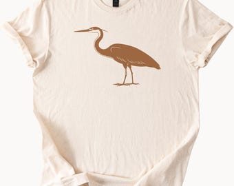Great blue heron minimalist bird graphic nature inspired earthy animal art beige t shirt unisex soft cotton wildlife lover gift tee