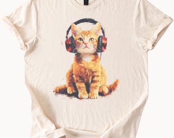Söt orange katt som bär hörlurar grafisk t-shirt musikälskare kattkonst tee unik katttröja gåva för kattägare cool djurtröja