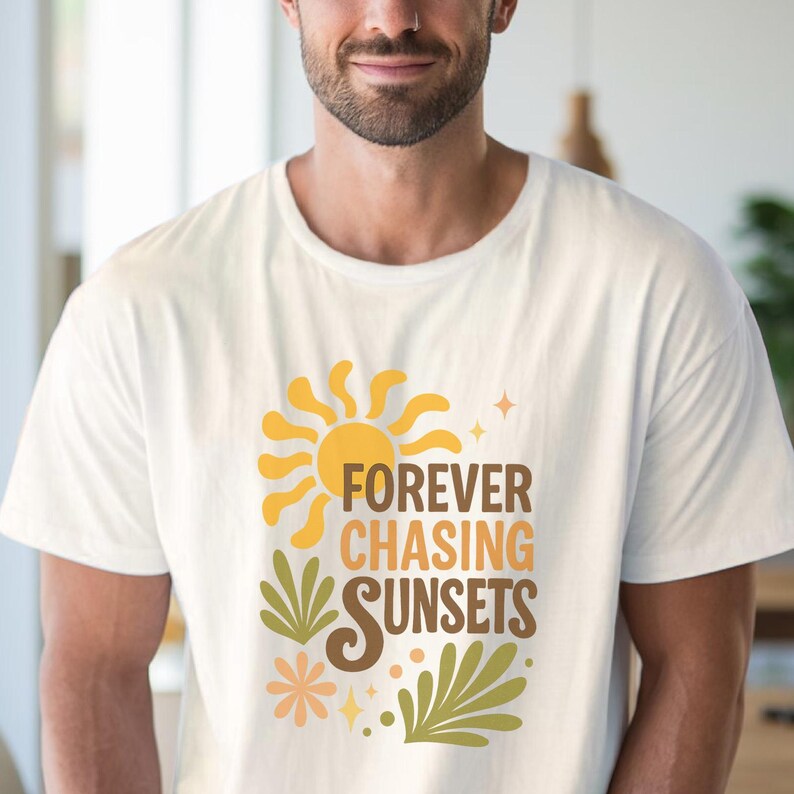 May include: White t-shirt with a retro design featuring a yellow sun, green leaves, and the text "FOREVER CHASING SUNSETS" in orange and brown. The shirt has a crew neck and short sleeves.