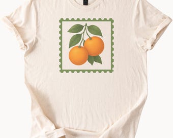 Orange Fruit Stamp Graphic T Shirt Botanical Citrus Art Tee with Two Oranges and Leaves Nature Illustration Soft Cream Shirt