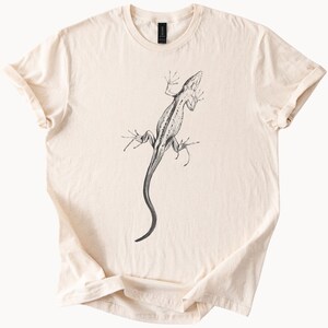 Ödla linjeteckning T-shirt djurkonst realistisk reptilillustration naturälskare minimalistisk skiss herpetologi ödla grafik
