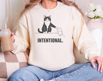 Intentional Cat Pushing Glass Off the Edge Sweatshirt