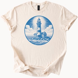 Lighthouse Graphic T Shirt Coastal Ocean Scene with Nautical Beacon and Seaside Landscape on Natural Soft Cotton Tee
