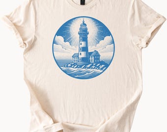 T-shirt graphique phare, scène côtière de l'océan avec balise nautique et paysage de bord de mer sur T-shirt en coton doux naturel