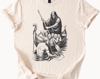 May include: A black and white illustration of a hooded figure in a boat with several people. The hooded figure is rowing the boat with an oar. The people in the boat are looking at the hooded figure. The boat is on a body of water. The illustration is on a beige t-shirt.