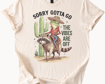 Cowboy Frog Riding Raccoon Sorry Gotta Go The Vibes Are Off Cactus Western Funny Animal Graphic T Shirt Gift for Animal Lovers