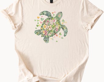 Camiseta con estampado floral de tortuga marina con flores tropicales y corazones, ideal como regalo para amantes de los animales de la naturaleza oceánica, estilo bohemio playero de verano.