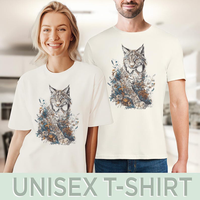 May include: Off-white unisex t-shirts featuring a detailed illustration of a lynx surrounded by flowers and foliage. The lynx is depicted in shades of gray, brown, and white, with the floral elements in blue, green, and brown. The text "UNISEX T-SHIRT" is at the bottom.
