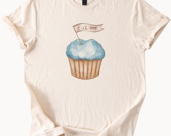 Camiseta "Cómeme Cupcake" de Alicia en el País de las Maravillas, divertida camiseta de panadería, idea de regalo para amantes de los libros de Lewis Carroll, camiseta para fiesta de cumpleaños