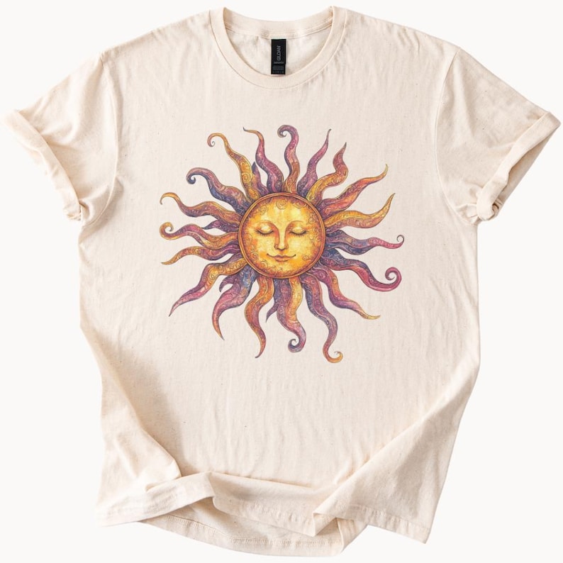 May include: A cream colored t-shirt with a colorful sun graphic. The sun has a face with closed eyes and a yellow, orange, and red color scheme.