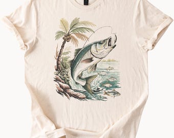 釣り人のための、ジャンプするオオクチバスのアウトドア自然デザインをあしらった釣りグラフィックTシャツ