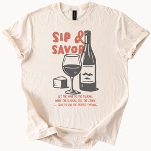 Sip and Savor Wine Lover Graphic T Shirt with Bottle Glass and Cheese Illustration Perfect for Wine Tasting and Foodie Gifts