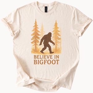 Believe In Bigfoot T Shirt Sasquatch Graphic Tee Forest Lover Gift Cryptid Hunter