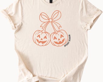 Camiseta de Halloween de temporada espeluznante, calabazas Jack O' Lantern con lazo, camiseta gráfica de otoño, cara de calabaza de Halloween, linda camiseta de otoño para Halloween