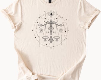 Camiseta gráfica de la balanza del zodiaco Libra, astrología celestial, arte del signo de equilibrio, constelación, sol, luna, estrellas, horóscopo cósmico.