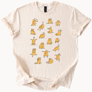 Funny Orange Cat Yoga Poses Graphic T Shirt Cute Cartoon Cat Lover Gift Animal Illustration Tee for Cat Owners and Pet Lovers
