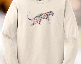 May include: Cream-colored long-sleeve shirt featuring a watercolor leopard design. The leopard is depicted in shades of pink, blue, and green, creating a unique and artistic look. The shirt has a classic crew neck and long sleeves.