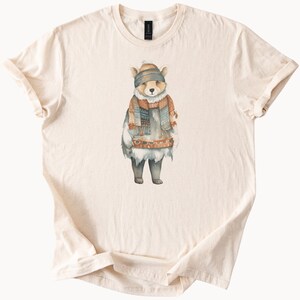Cute winter bear wearing cozy knit scarf and beanie graphic shirt fall animal illustration tee cozy woodland forest theme t shirt