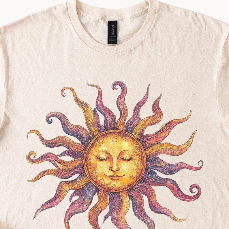 May include: A beige t-shirt with a colorful sun graphic. The sun has a face with closed eyes and a smile. The sun's rays are purple, orange, and yellow.