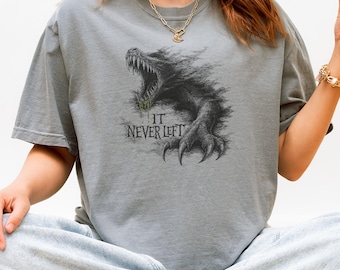 It Never Left Dark Creature Emerging from the Swamp Tee