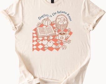 Shirt Chapters in the Autumn Breeze Herfstpicknick Grafisch T-shirt met boeken Koffiemand Appels Pompoenen Literaire herfstmode