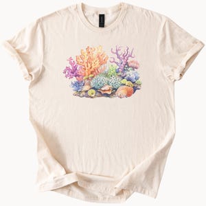 Colorful coral reef ocean scene graphic with sea shells and tropical marine life soft nature inspired beach t shirt ocean lover gift