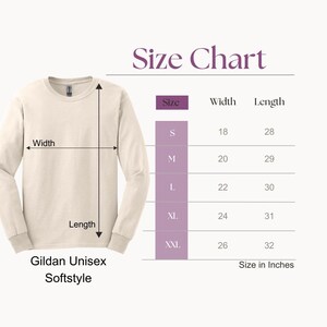 May include: Cream-colored Gildan Unisex Softstyle long-sleeve shirt with a size chart. The chart shows measurements in inches for sizes S to XXL, with widths from 45.7 to 66 cm and lengths from 71.1 to 81.3 cm.