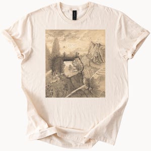 Camiseta gráfica con paisaje de montaña y río, dibujo natural único, paisaje panorámico al aire libre, desierto, árboles, picos, nubes, arte, camiseta de algodón beige