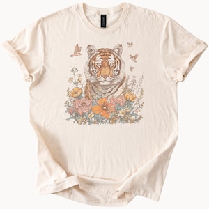 Tiger in Wildflower Garden Graphic Tee with Butterflies and Birds Nature Inspired Animal Art Shirt for Wildlife and Floral Lovers