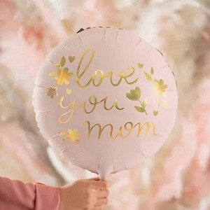 May include: A pink balloon with gold lettering that says "love you mom" and gold floral accents.
