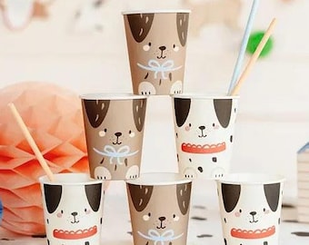 May include: Set of six paper cups featuring different dog illustrations. The cups are brown and white with black accents. The dogs are wearing different accessories, such as a bow tie, a collar with a tag, and a red bandana.