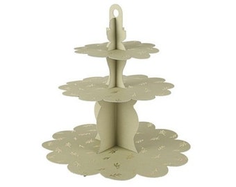 May include: A three-tiered cardboard cake stand with a white background and gold leaf accents. The stand is decorated with a floral pattern.