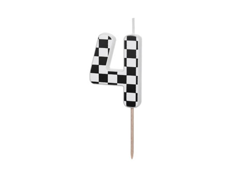 May include: A white birthday candle shaped like the number four with a black and white checkered pattern.