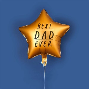May include: A gold star-shaped balloon with the text "BEST DAD EVER" printed on it.