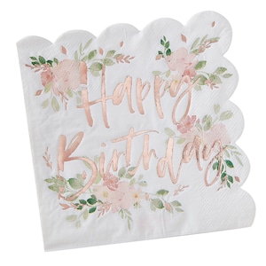 May include: White scalloped-edge paper napkin with the words "Happy Birthday" in rose gold script. The napkin is decorated with watercolor-style pink flowers and green leaves, creating a floral design.