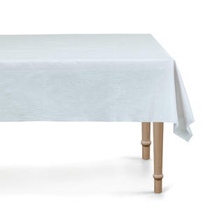 May include: White linen tablecloth draped over a wooden table with four legs. The tablecloth is smooth and has a slight sheen.