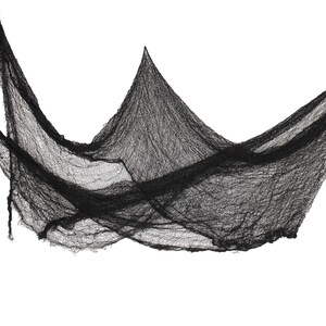 May include: Black, draped fabric with a distressed, cobweb-like appearance. The material is loosely woven, creating a textured effect. This Halloween decoration is ideal for creating a spooky atmosphere.