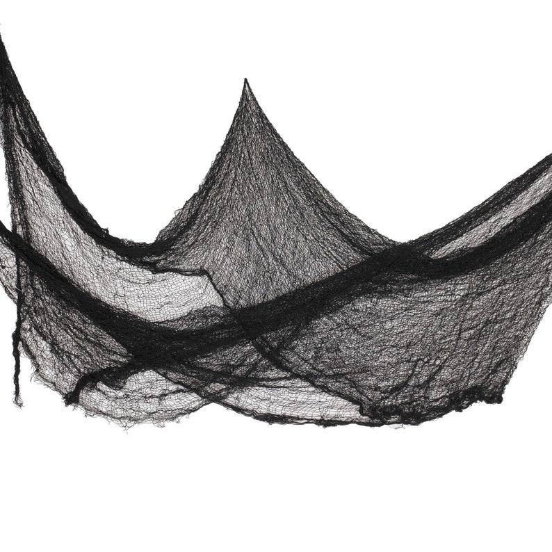 May include: Black, draped fabric with a distressed, cobweb-like appearance. The material is loosely woven, creating a textured effect. This Halloween decoration is ideal for creating a spooky atmosphere.