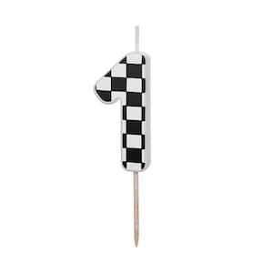 May include: Black and white checkered number one candle with a wooden stick.