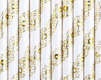 Könnte beinhalten: Weiße Papierstrohhalme mit goldenem Blumenmuster. Das Muster ist ein sich wiederholendes Design aus stilisierten Blumen.
