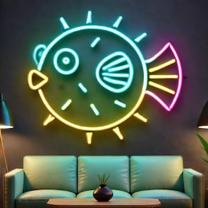 May include: A neon sign shaped like a pufferfish with yellow, green, and pink outlines. The sign is lit up and hanging on a dark wall.