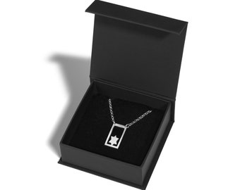 May include: A silver necklace with a Star of David pendant in a black velvet jewelry box.