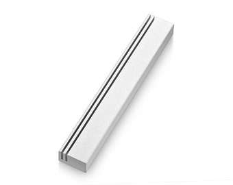 May include: A silver metal trim with two parallel grooves running along its length.