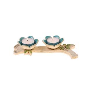 Candlestick pair of flower flasks on a branch
