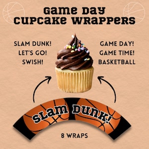 May include: A cupcake with chocolate frosting and colorful sprinkles sits above a basketball-themed cupcake wrapper. The wrapper has the words "SLAM DUNK!" and a basketball design. Text on the image reads "Game Day Cupcake Wrappers."