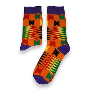 May include: A pair of orange, green, yellow, and black patterned socks with purple cuffs.